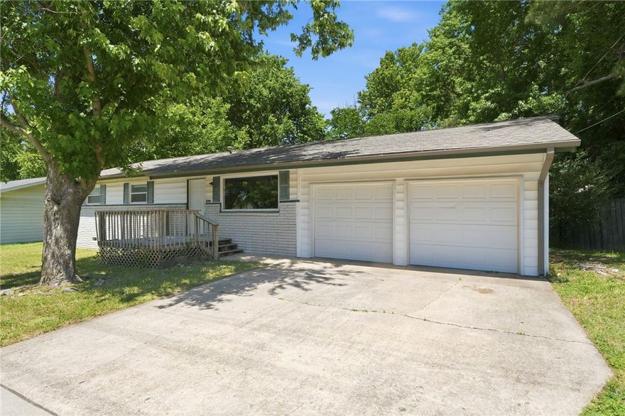 Opportunity awaits at 2908 W. Mount Comfort Rd in Fayetteville. This home is a solid option for investors or a future homeowner. Located a 1/2 mile from I-49 and approximately 3 miles from the University of Arkansas. Offering 3 bedrooms, 1.5 baths, and a 2-car garage, this property sits on a flat 0.30-acre lot with a large backyard ideal for outdoor enjoyment or future possibilities.