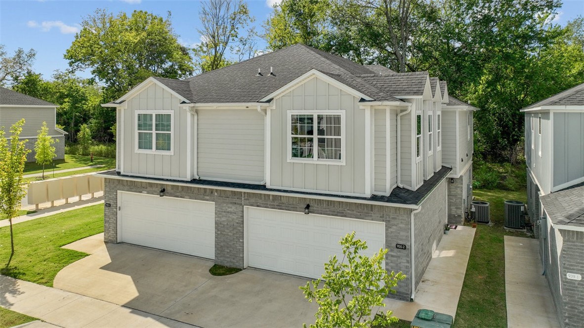 This property is an investment dream! Just minutes from I49 and the University of Arkansas. This duplex is situated on a corner lot backing green space, offering additional privacy. Inside you will find granite counters, vinyl luxury plank throughout, washer and dryer upstairs for convenience, spacious living area, and a large private patio for relaxation and entertaining. This would be perfect for University of Arkansas students, young professionals, corporate housing and more. Located on Fayetteville trail system.