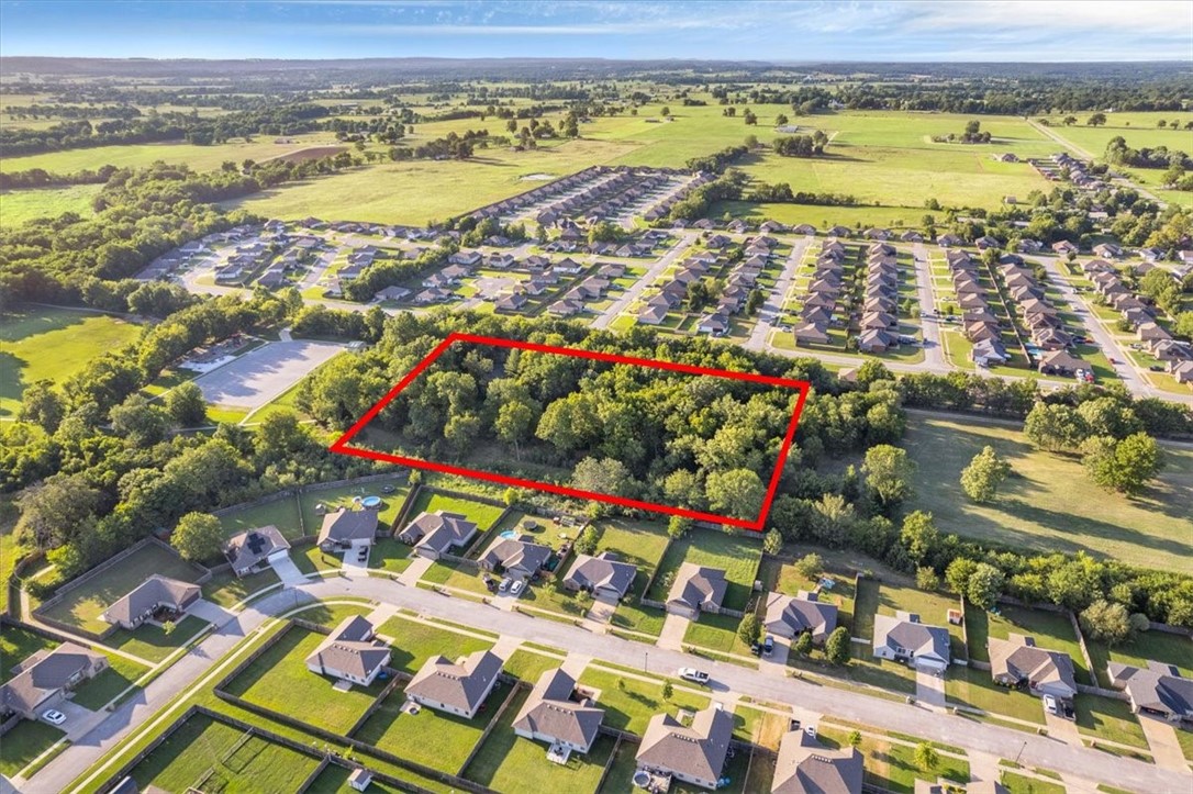 Location, Location, Location! This 4 acre mol property is located in a highly desirable area of Prairie Grove. The property butts up to beautiful Muddy Fork Park allowing for easy access to the playground, dog park, and walking trails. Ideal location to build your new forever home! 2 septic systems on site, Electric on site, public water has been ran to the property. Mobile home and carport to convey in current condition with no seller repairs or improvements. Schedule your showing today!