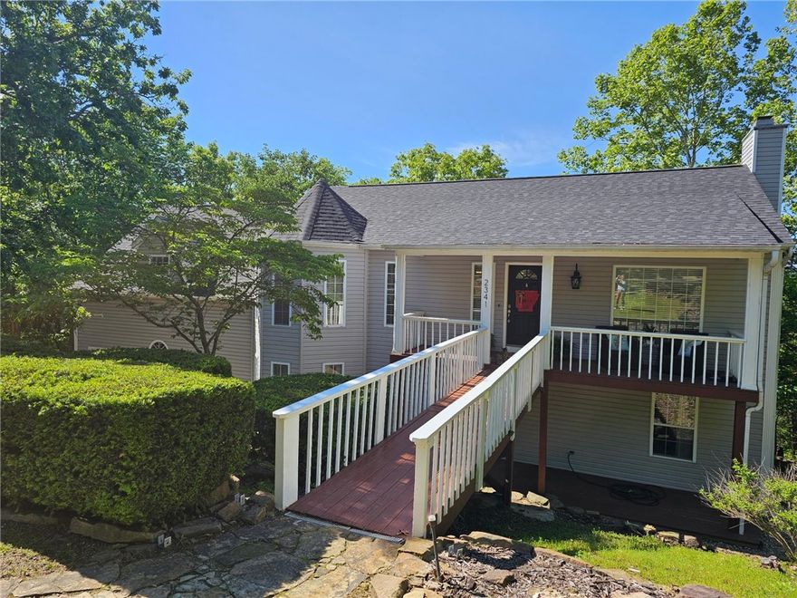 Welcome to your private retreat in sought-after East Fayetteville! This beautifully maintained 3,192 sq ft home(new roof Nov.2024!) offers 5 bedrooms and 3 full bathrooms, perfectly situated on 6.33 scenic acres. Enjoy soaring vaulted ceilings, spacious living areas, and natural light throughout. Step outside to take in the breathtaking views from your back porch, or make your way downstairs to explore your very own private nature trail that includes a family friendly covered pavilion. Continue your way to the lower property with detached storage building, 50'x50' cement pad for activities and plenty of room to roam. Additional features include an oversized 2-car garage, detached outbuilding for storage or your next man cave or private home office. A rare opportunity to enjoy peaceful, country-style living with the convenience of nearby city amenities. Don’t miss this one-of-a-kind property!
