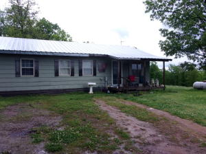Call it Home or would make a great get-away being within minutes of CenterPoint trail and the Buffalo National River at Ponca, Steel Creek and Boxley.. 3 Bedroom 2 Bath with central heat and air on 9.67 m/l private acres with some open land with plenty of room for gardening and a stocked pond for watering a couple of Horses. 16x16 outbuilding with new 24x30 2 car garage/workshop. Enjoy the peaceful view watching the wildlife roam from the covered front porch.