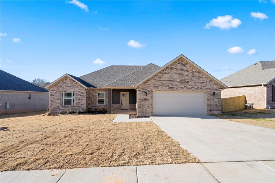 This brand new home blends clean design with everyday functionality. Light-filled main living spaces feature wood-look tile flooring, vaulted ceilings, and a gas fireplace that anchors the open layout. The kitchen makes a statement with crisp white cabinetry, stainless steel appliances, a gas range, and an oversized island accented by contemporary pendant lighting. The primary retreat offers a peaceful escape with a spacious ensuite featuring dual sinks, a soaking tub, a fully tiled walk-in shower with glass doors, and a large walk-in closet. Thoughtfully constructed with energy-efficient features and neutral finishes throughout. Ideally located near local amenities and city park access, this move-in-ready home offers comfort, style, and quality craftsmanship. Home comes with Blinds, Gutters and a fully fenced and sod yard.