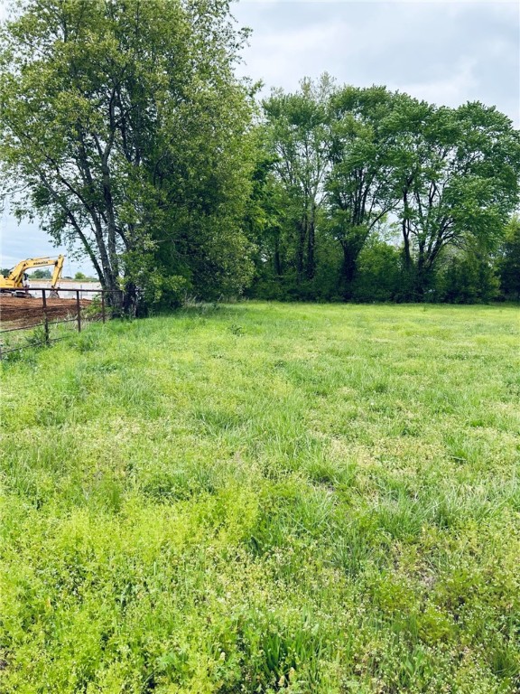 Rare opportunity, 4.85 acres in developing area, all utilities available, commercial area, street frontage access and street access to rear of the property. Located in commercial district of Centerton, highway 102 frontage. Rapidly developing area, adjoins largescale development. Suitable for business, storage units ,restaurant, strip shopping, town homes or apartments, etc. Small area crossing the front of the property is included in 100 year flood plan. That area can be used for parking lot.