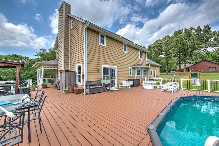 Nestled on 1.75 beautiful acres with a mix of cleared land and mature woods, this property offers a peaceful, secluded feel just minutes from town. Enjoy the outdoors from the expansive wraparound deck or relax by the above-ground pool with Trex composite decking. Inside features 3 bedrooms plus a bonus room, 2.5 baths, a large eat-in kitchen, and a spacious living room with a cozy pellet stove. The second bath has been remodeled, and the home also includes a new water heater and windows with a transferable lifetime warranty. A wonderful blend of privacy, comfort, and convenience in a truly lovely setting. 3rd Bedroom not displayed in photos, will update soon