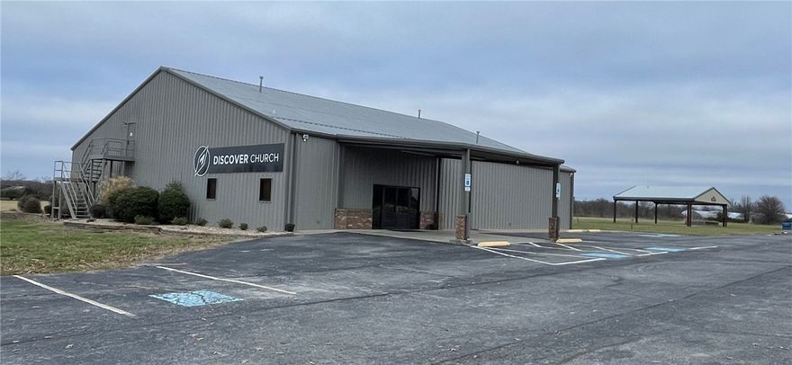 Wow! This one won't last long! This approx 7650 sq ft metal building has unlimited potential! It's a great opportunity and rare finding! Currently being used as a church with 6400 sq ft on first level and over 1250 sq ft on the second level. It features a center gathering area of 2100sq ft. Seating over 150 chairs but expandable up to 250 seating capacity. There is currently a cafe area, children's ministry area, multiple offices, nursery and multiple storage spaces. Outside pavilion boasts over 2100 sq ft of cover space for gatherings. Could easily be closed or screened in! The parking lot has over 100 parking spaces and two entrance points for this property make it a spectacular choice for any use of the property. This listing includes a total of 3 parcels. Parcels #02-00633-005, Parcel 02-00633-006, Parcel #18-05085-001. For a total 18.16 acres! Current offer with contingency has escape clause so we are taking backup offers! Come see this property today before it is gone!!