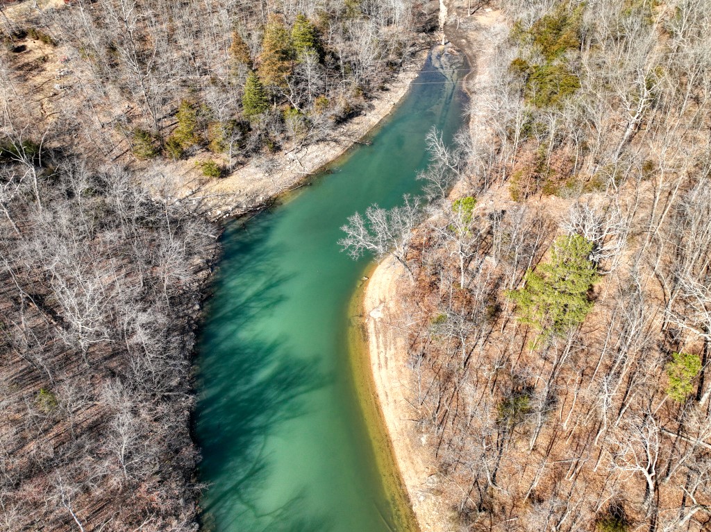 One of two excellent, private lakefront lots in the back of a quiet cove. The small subdivision named Bluewater Cove, is off the beaten path but is not hard to get to. Lot has a private driveway already cleared into the house site. The woods in and around this lot are not heavy with underbrush so walking is easy. This land would be perfect for a Beaver Lake getaway cabin! The adjacent lot is also available. These tracts do not have the ability to have a dock. Agent Owned.