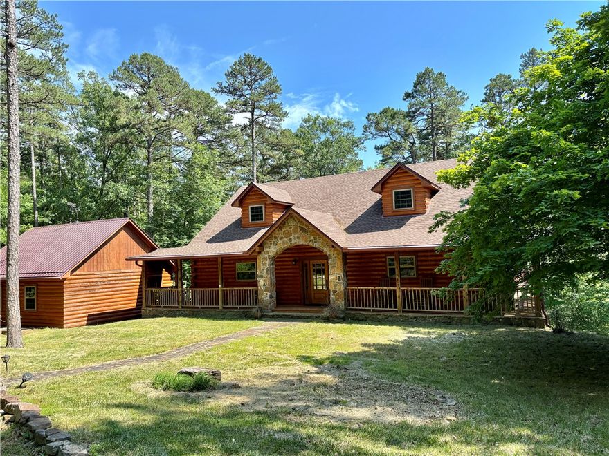 Discover your own slice of paradise with this stunning custom Log Home executive retreat, nestled on 22 acres bordering the Ozark National Forest. Boasting over 4200 square feet of luxurious living space and nearly 2000 square feet of outdoor space with covered porches and a deck, this home is a true gem. Step inside to find magnificent beamed ceilings adorned with antler chandeliers and large windows that frame breathtaking views. With three levels of comfort, this home is move-in ready. Simply drive up and spend the night, as it comes nearly fully furnished with top-of-the-line pieces. The basement is a treasure trove of amenities, featuring a Theater Room with surround sound, a Family Room with a Pool Table, a Brewery Room for crafting your own beer and wine, a furnished Exercise Room, a Wine Cellar, and more! This secluded property is just 1/2 mile from a paved road and shares a border of the Ozark National Forest on two sides, providing direct access to explore the forest. Located only 15 minutes from Jasper.