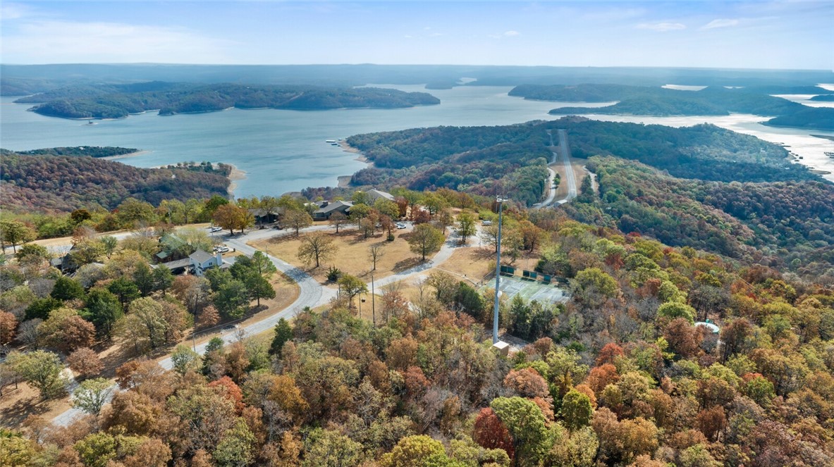 Your opportunity to own a stunning Arkansas gem: Whitney Mountain Lodge above Beaver Lake! Whitney Mountain Lodge is a breathtaking lodge perched 700' above Beaver Lake and sits on +/- 25 acres! This property offers year-round, panoramic views of the lake with key features including 16 rooms, outdoor patio, downstairs bar, and extensive renovations completed in 2002/2003, with hotel rooms updated in 2010. This property is also likely the only redevelopment opportunity with sewer access, it offers an investor the potential to redevelop the site into many different uses, including, Corporate and Family Retreats, Recreational Facility, Hotel Units, Apartments, Mixed-Use Development, Resort Development, Condos, Convention Centers, or many other uses with stunning views of Beaver Lake. Imagine hosting weddings on the patio, opening an upscale restaurant, or hosting corporate retreats! With endless possibilities, you can create an unforgettable experience for every guest! Don't miss out on this extraordinary investment!