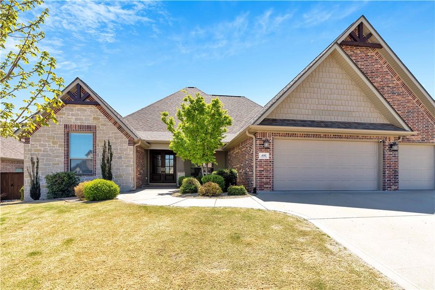 Looking for a large 4 bed/4 bath home in sought after subdivision? Welcome home to Woods Creek. Very open floor plan. Master bedroom, living room, dining and office all feature hand scraped wood floors. New carpet in the 3 remaining bedrooms all on main level of home. Upstairs Bonus Room also has new carpet as well as a full bath which could could be 5th bedroom or in law suite with walk in closet. 3 car garage with epoxy seal floors. Backyard features a covered patio for all your family and entertaining needs . Home is wired for sound speakers throughout.