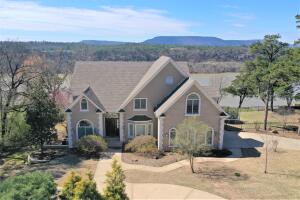 Lying in one of West Russellville's most prestigious neighborhoods of Lands End, this home is nothing short of spectacular. Being a waterfront property on the Arkansas River, your views of Mount Nebo and the water spanning as far as the eye can see in each direction. Boasting of amenities around every inch of the 7000sqft and 3 level home, 5 bedrooms and 5 baths, formal and eat-in dining areas, office space, sitting areas, you'll never run out of space for your family or entertaining guests.