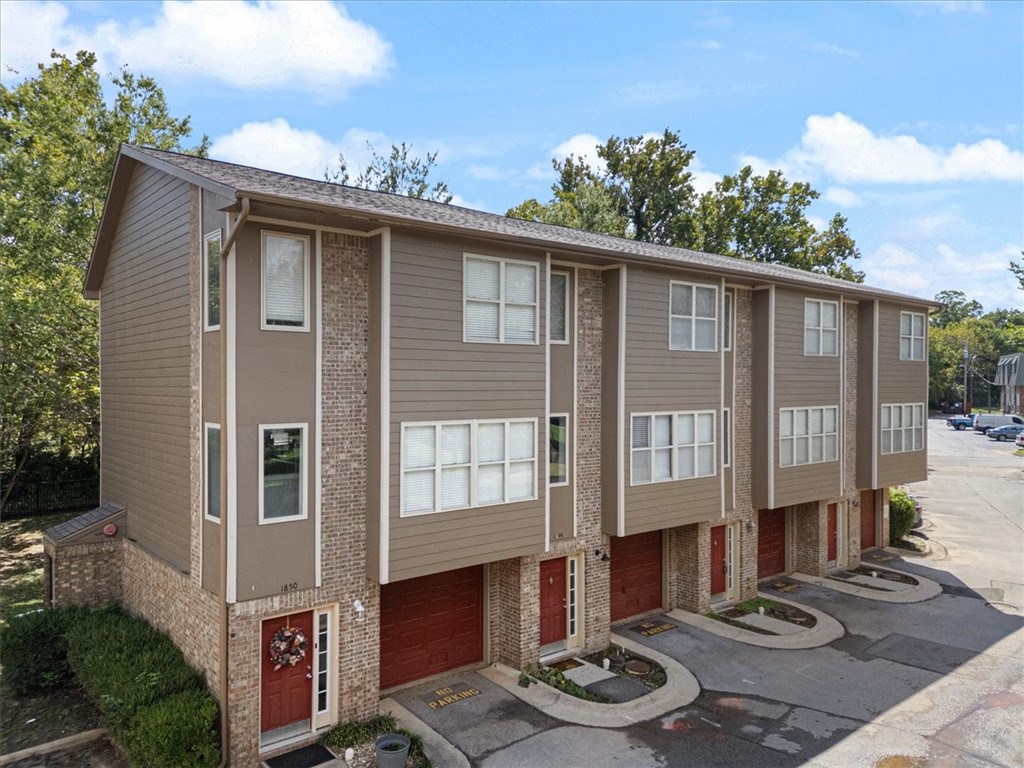 Welcome home to this beautifully updated condo just minutes from the University of Arkansas and the heart of Fayetteville! Step right outside your door and onto the Razorback Greenway, perfect for morning runs, evening bike rides, or leisurely walks through town. Inside, you’ll love the recent updates, including new vinyl flooring, granite countertops and appliances. This spacious home also features 2.5 bathrooms and a private one-car garage—offering both comfort and convenience. Built in 2007, the property has been exceptionally maintained with new roofs, fresh exterior paint, and thoughtful upgrades throughout. Whether you’re searching for a personal home near campus or a rare investment opportunity, this condo checks all the boxes. Enjoy a quick 6-minute drive or an easy 8-minute bike ride to the U of A, plus reliable cash-flow potential in a highly desirable location. Don’t miss your chance to own a well-maintained, updated condo right off the Razorback Greenway!
