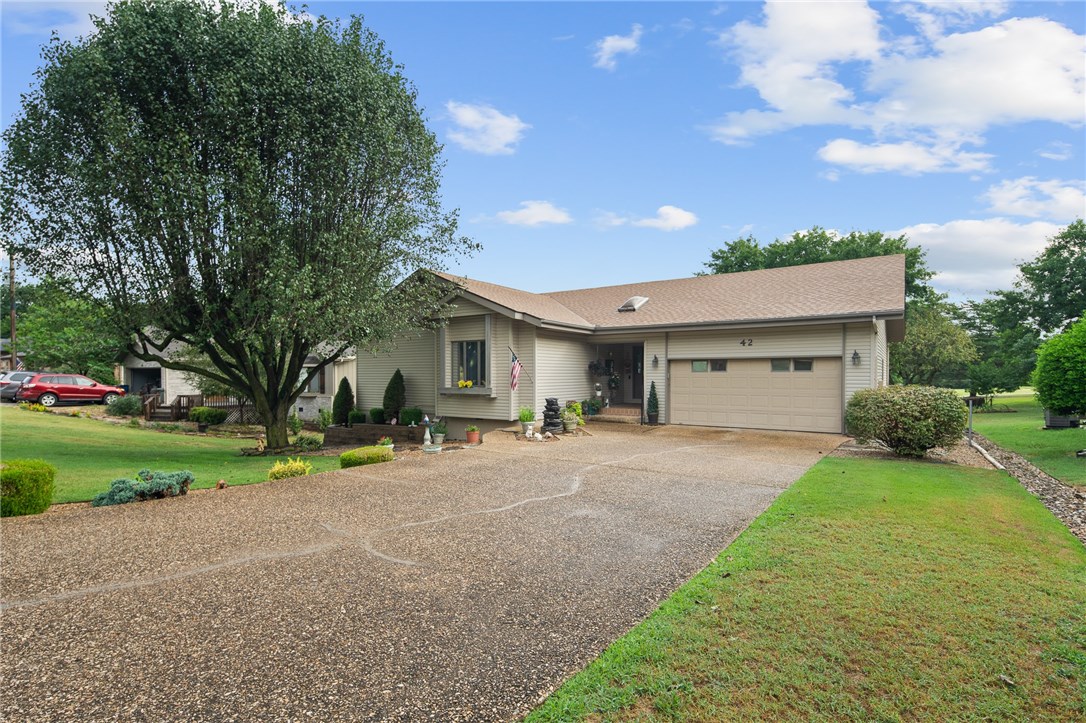 Golfing enthusiast dream location. Drive your golf cart directly to the course from your backyard. Enjoy the morning sun from your screened-in porch or adjoining open deck overlooking this lovely, flat, backyard and the golf course view of the 11th hole of Kingswood Golf Course. Kitchen, living and dining rooms as well as 2 bedrooms/2 baths on the main level. A 3rd full bath with small wet bar in the approx 700 sq ft completed walk-out basement. You will love the large master bedroom with en-suite bathroom and dressing area with skylight as well as 3 closets that provide ample storage. Central air with radiant heat in the basement and upstairs fireplace with blower. A cistern water system is in place that can be used to water the raised bed vegetable garden. Five (5) minutes to shopping and dining.