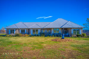 YOU HAVE FOUND YOUR DREAM! Million dollar view from home and 232 acres with 5 spring-fed ponds stocked with fish & 5 large springs & 2 waterfalls!! Numerous drivable trails throughout property with deer & turkey. Metal horse barn has 6 horse stalls w/solid treated walls & doors at each end. Stalls are 12x12 & 12x16. Custom built home has Knotty Alder kitchen & bath cabinets, interior trim, and built-in shelves in living room. Also features pantry, solid wood doors, walk-in tiled showers, 10' ceilings, & a Hardy Outside Wood Stove. (heat pump or the Hardy for heat and also heats the water when in use. Or it has a heat pump & electric water heater.) The covered back porch has the view that you have been wanting! Close to Ponca, Buffalo River, Harrison and Fayetteville. All #'s approximate.