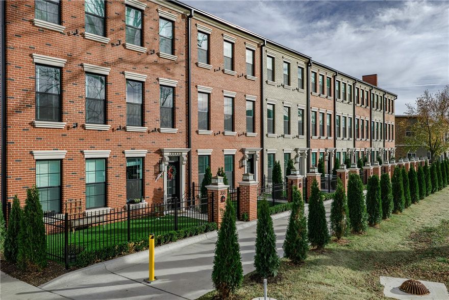 Step into the epitome of luxury and elegance at Oak One, where these Bostonian-classic inspired brownstones redefine upscale urban-living in downtown Bentonville. Each residence exemplifies unparalleled craftsmanship and attention to detail, from the majestic cast stone and brick exteriors to the exclusive private green space courtyards. Designed for discerning tastes, this home features herringbone hardwood floors, elevator, towering solid core custom doors, and bespoke high-end finishes including 24k-gold plated light fixtures and a stunning 1000-light teardrop chandelier. Indulge in the pinnacle of convenience with touches such as Hansgrohe faucets/shower-heads, high-end smart toilets & mirrors, heated towel racks, and counter-depth inset LG appliances throughout. Enjoy a lifestyle of sophistication mere steps away from some of Bentonville's most iconic landmarks such as the Ledger, Pedaler’s Pub, Skylight Theater, the adjacent bike trail and more! Embrace urban luxury at its finest—your home awaits at Oak One.