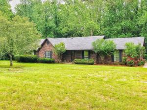 Wonderful home in an excellent Center Valley location on 1.24 acres! The spacious beautiful grounds of this property are the perfect setting for this beautiful home that features 5 bedrooms, 2 full baths! Two of the bedrooms are currently used for office and hobby rooms, but could be anything you like! The large living area has a vaulted ceiling and a cozy fireplace and the kitchen is updated and modern! Outside there is an ample deck overlooking the private back yard framed by mature trees. There is a charming gardening area and a detached garage for storage!