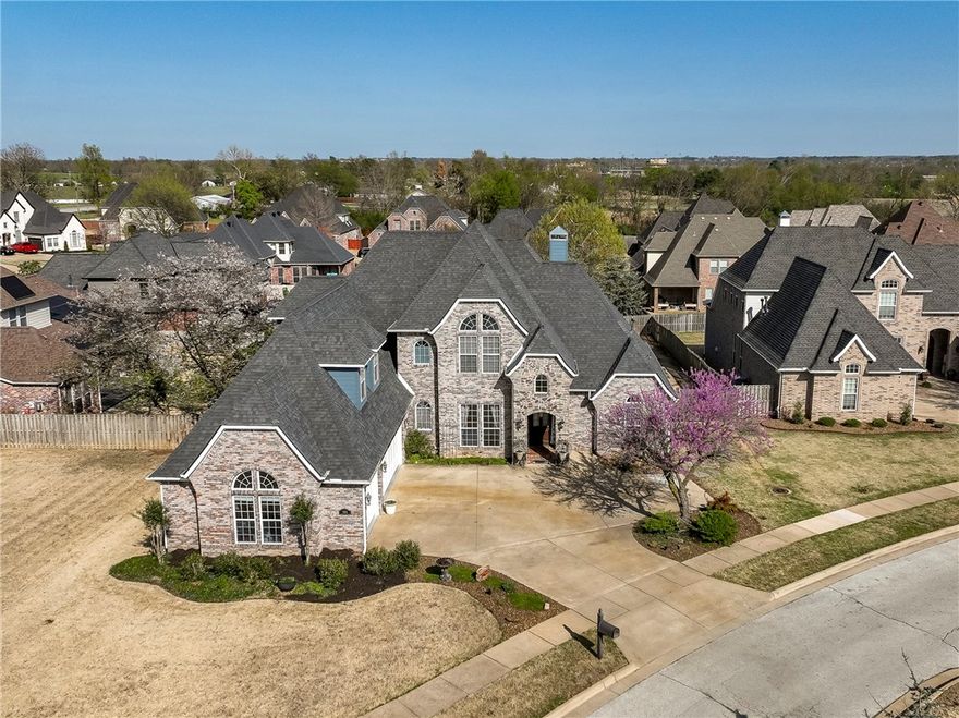 MUST SEE! This picture-perfect home in Turnberry at the Peaks offers quick access to The Promenade, Walmart AMP, Pinnacle Hills, and I-49—putting all of NWA within easy reach. The flexible 2-level layout features a main-level primary suite plus two secondary bedrooms with an ensuite bath. Upstairs you'll find two more ensuite bed/baths and a HUGE bonus room—perfect as a media room, office, or playroom. Step outside to a private backyard oasis, all new in 2023! Enjoy a covered patio and deck overlooking a custom 16x32 gunite pool with mineral filtration and a covered pavilion—ideal for entertaining a big crowd or enjoying quiet evenings alone. Built in 2010, this home has been beautifully updated since 2020 with an architectural shingle roof, wood flooring in all bedrooms, new tile in bathrooms and kitchen, fresh paint throughout and more. Located in one of NWA’s most desirable neighborhoods, this home blends comfort, style, and location. Don’t wait—schedule your showing today! No showings before Friday, April 4.