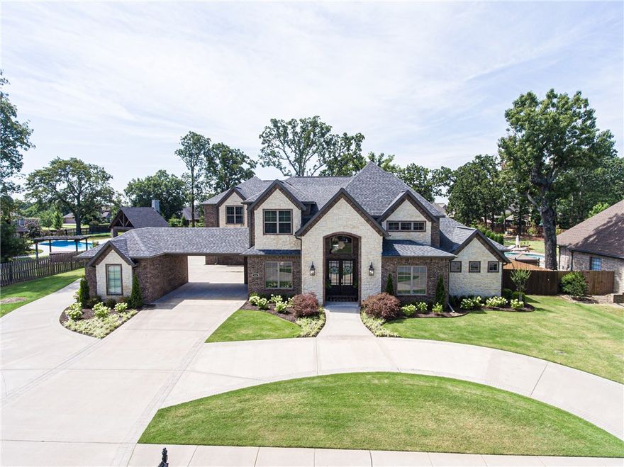 A spectacular outdoor living area makes this a perfect home for entertaining! Relax by lounging by the over-sized pool or around the cozy fire pit, all while making your favorite meal on the over-sized built in grill with kitchen sink, refrigerator and kegerator at the outdoor bar. Inside you will find customized details throughout the home. 21ft ceilings in the great room, a loft area upstairs, secluded media room, LARGE gym, to custom audio system throughout the home. A lavish Master Suite is located on its own side of the residence with a spa-like master bath with extra-large walk-in shower, and two very large walk in closets and built in cabinets. Truly an owner?s retreat. Every over-sized spacious bedroom has its own bath, large walk in closet and special unique finishes. Every bit of this floor-plan was well thought out and maximizes every bit of space this home has to offer. Definitely a must see!