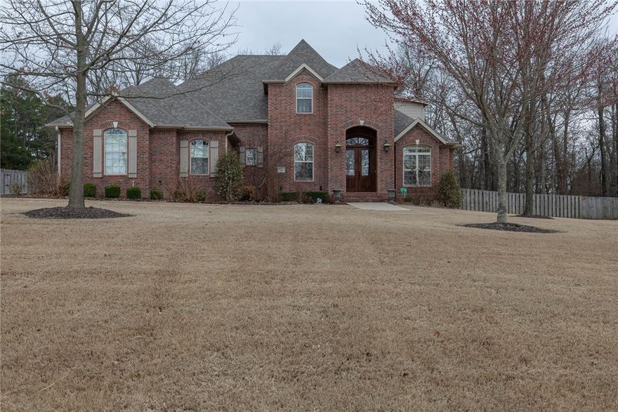 Welcome to this STUNNING traditional home on HUGE 1 acre corner lot that is situated in close proximity to beautiful Sassafras winery. Home has been meticulously maintained & exudes charm & elegance at every turn. Upon entering, you are greeted by a glass framed study entrance & Dining room that is perfect for entertaining. Bright & airy living room features gleaming hardwood floors, a cozy fireplace, & large windows that flood the space with natural light.  Kitchen is a chef's dream, featuring large island, high-end appliances, oversized integrated refrigerator, & a breakfast nook that is perfect for casual meals, featuring built-in hutch & buffet area. Primary suite is a true oasis, with a large sitting area that includes a gas log fireplace & glass built-in study, luxurious bath that features a whirlpool tub, walk-in shower, custom walk-in closet, built-in dressers, & floor-to-ceiling hanging space. Outdoor living & entertaining, covered patio with fireplace & plenty of space for gathering with friends & family.