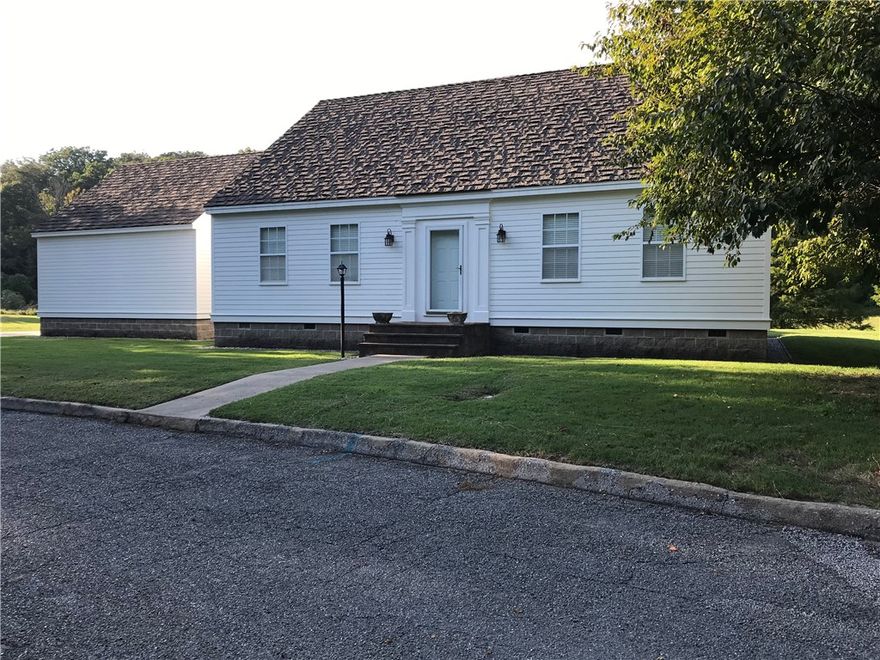 This beautifully crafted replica of a Cape Cod Revival home sits on 0.72 of an acre in a quiet valley in western Benton County. The main level offers convenient one-level living with a spacious primary bedroom and private bath. The kitchen features handmade cabinetry designed to reflect the home’s historic authenticity, while select antique light fixtures and period-style door hardware enhance its classic appeal. The home offers two living areas; a large, light-filled formal room, traditionally referred to as the "parlor" in keeping with the home’s period-inspired design. Then a more intimate living room is just off the kitchen, with a gas log fireplace and double doors that open to views of the backyard.  Upstairs, two additional bedrooms and a full bathroom provide ample space for family or guests. Rich, 1" thick solid wood flooring runs throughout the home, reinforcing its timeless character. Claw foot soaking tubs are in the two full baths, plus there's a half bath on the main level. No showings until 01/28/26.