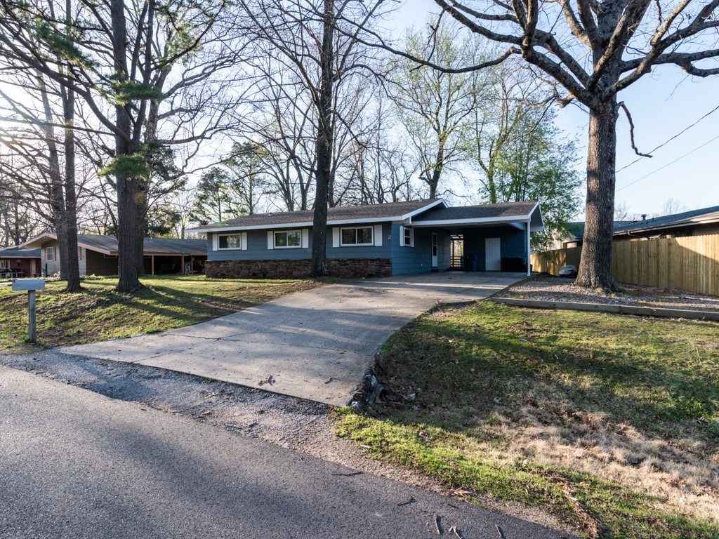 Seller will pay up to $5000 in closing costs with accepted offer! Newly updated- 3 bedroom, 2 bath home with attached carport. Great location- located right off the back 40 trails for biking, walking, and with all POA amenities to enjoy- Pools, Playground, club house, lakes and more...New Roof and HVAC as of 2019. New Heat & Air Unit- installed 2020. Updated paint and New Stainless steel appliances in 2022, Newly installed Quartz counters in kitchen & vinyl flooring & tile through out, Newly installed double pane windows/ patio doors in 2022 & Brand new septic 2022. Covered back deck to enjoy- slightly wooded. 8X10 Shed in back to convey. Work shop attached as well- great for extra storage as well.
