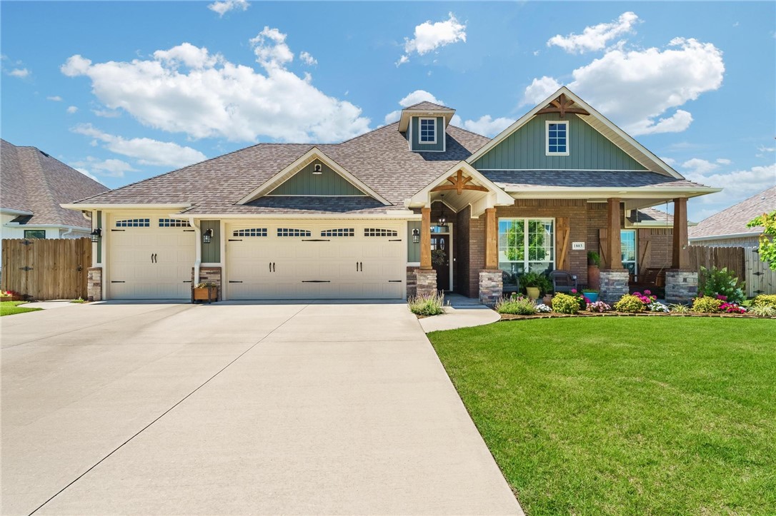 Move right into this fantastic home where updates abound! Enjoy a professionally landscaped yard with an agricultural water meter for the sprinkler system, ensuring low watering costs. The insulated garage boasts an 8-foot tall third-car door and an electric attic lift for ultimate convenience. Relax or entertain on 725 sq ft of extra-large patios under a covered pergola with a new metal roof. Security is paramount with a storm shelter safe room. Other highlights include very cheap electricity, and a natural gas quick-connect on the back porch. A sidewalk from front to back porch adds to the seamless outdoor flow. This remarkable home offers a perfect blend of comfort, efficiency, and fantastic outdoor spaces, all within an excellent location and community. Step inside to a popular split floor plan and enjoy the beauty and durability of wood-look tile throughout. The kitchen boasts energy-efficient appliances, contributing to the home's overall affordability and enjoy the conveniences of the ever growing Pea Ridge!
