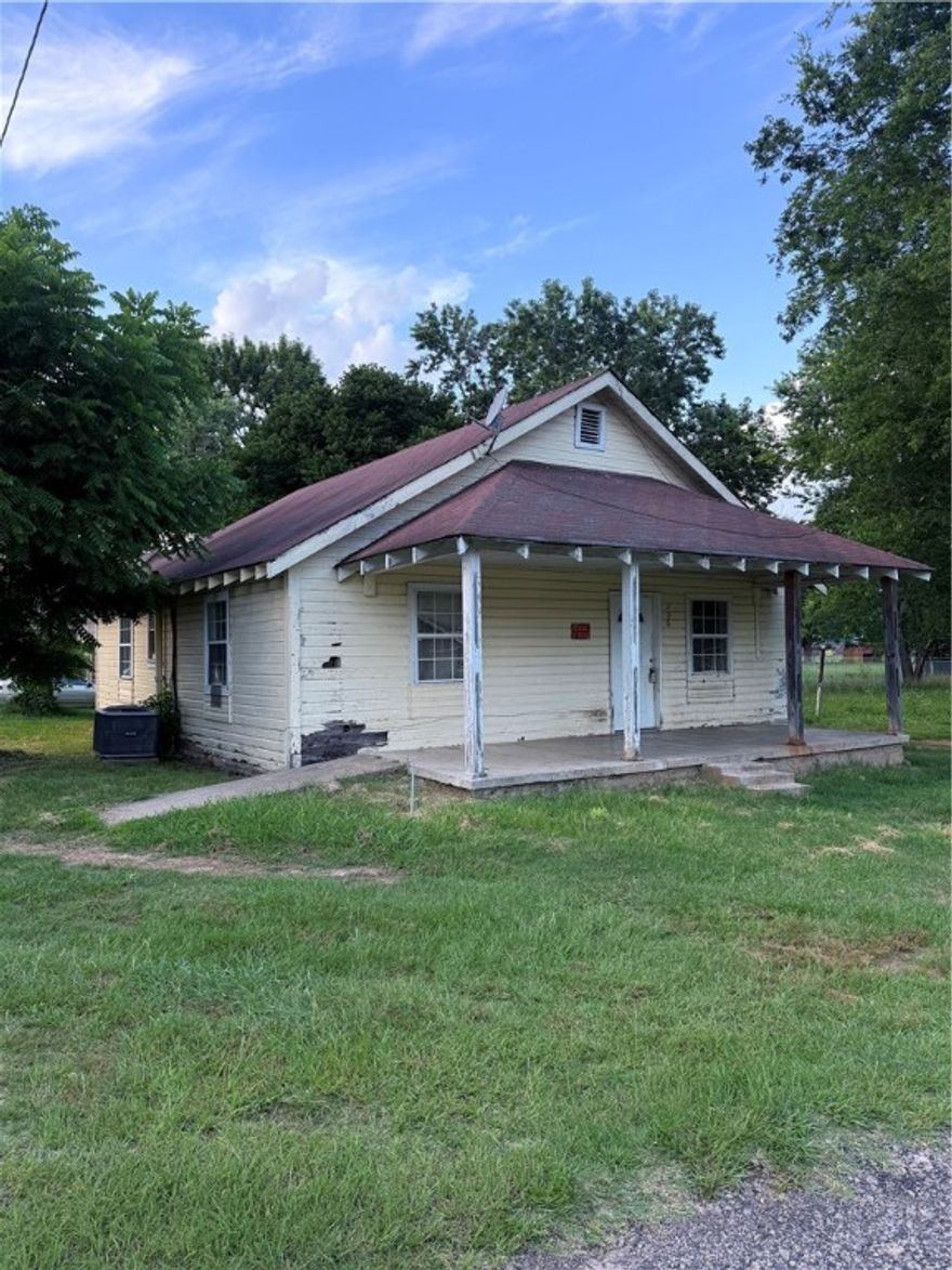 Investor Special! This 3-bedroom home is located right in the center of town and just one block from the school — a perfect setup for a rental property or renovation flip. Whether you're expanding your portfolio or starting fresh, this property offers location, potential, and value. SOLD AS IS