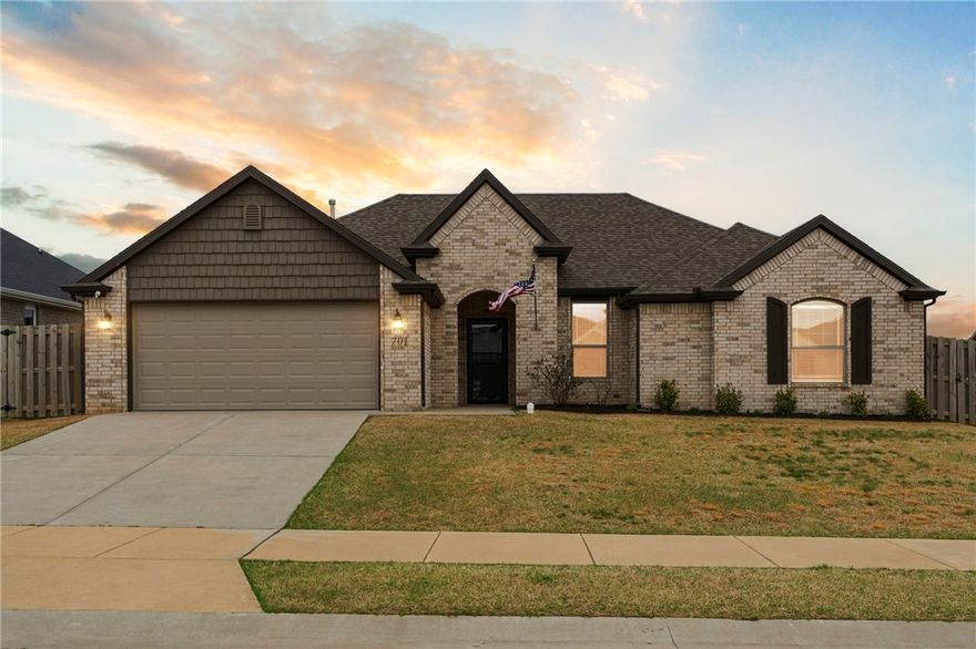 Welcome to this beautifully maintained home in the heart of NWA, nestled on a quarter-acre corner lot and built by Riverwood. The open floor plan is filled with natural light and thoughtfully appointed throughout — featuring LVP flooring, crown molding, black granite countertops, a white farmhouse sink, and a cozy gas fireplace. Practical touches like gutters, attic storage, blinds, Christmas light outlets, and floor outlets in the living area make everyday living effortless. The spacious master suite offers two walk-in closets, a whirlpool tub, and a walk-in shower. Step outside to a covered patio with a swing, perfect for entertaining, grilling, or simply unwinding. This is the one you've been waiting for.