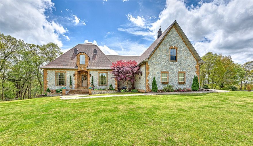 Enjoy year round panoramic views of the White River/Beaver Lake! This 7,177 square foot home is amazing! With a primary suite on every level, this home could be perfect for a variety of options! (In-law suite, investment opportunities, large family, vacation home, entertainment home, etc.!) This 4 bedroom, 3.5 bath home is a must see! Did I mention there is a full kitchenette/living room/game room/safe room/and two bedrooms on the bottom floor? With large windows throughout you can enjoy lots of natural light! Some upgrades include: smart thermostats, smart blinds, storm shelter/safe room/wine cellar, keypads on all exterior doors, two garage spaces with one leading into the main floor and the other to the finished basement level, wired security system, whole house fan, hot water recirculating pump in primary bath, natural gas generator, LED lights inside and out, Cafe' Double Ovens/Cafe' Gas stove top, new dishwasher, and so much more! Seller to offer $15,000 buy down credit or closing costs credit.