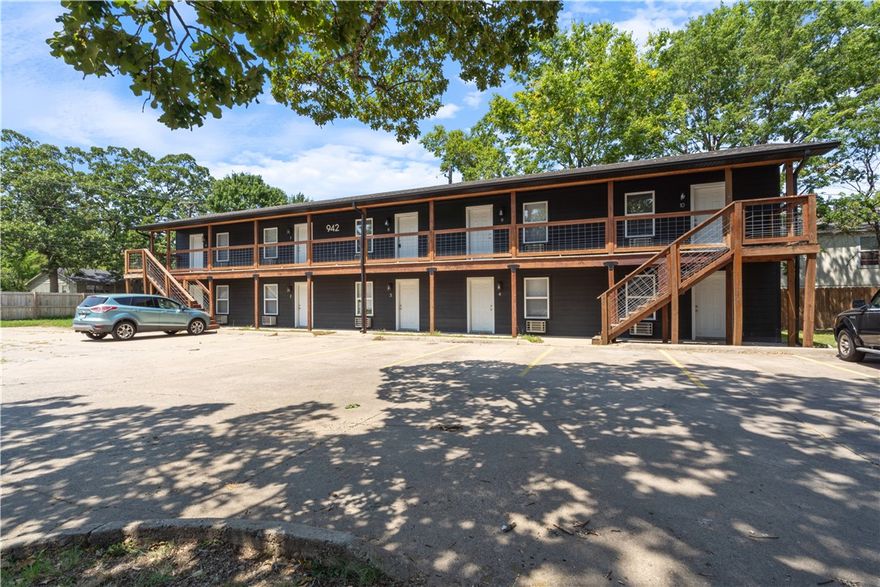 942 W Holly is a multifamily investment property located in core Fayetteville less than a mile from University of Arkansas campus. The property consists of 10 fully renovated studio apartments that are ~300sf. Each unit has been renovated with high-end finish outs including LVP floors, granite counters, upgraded cabinets, stainless steel appliances, and fully tiled bathrooms. While the property is stabilized and fully occupied, there is room to push rents about $70, supported by local comps. The location is unbeatable being 3/4 mile from University of Arkansas campus (5 minutes by bike, 19 by foot, 9 by bus), adjacent to popular restaurants and retail at the corner of North and Garland, a half block from two University transit stops, and 1/4 mile from the Razorback Greenway. The property is listed with it's 8-unit sister property located at 969 W Holly St MLS# 1284668.