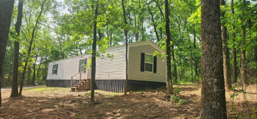 Tucked away on the outskirts of Dover, this charming 2 bedroom, 2 bath mobile home offers the perfect blend of comfort, privacy, and country living. Situated on 2.45 acres in a peaceful wooded setting, this 3-year-old home provides a quiet retreat while still being conveniently located.

Inside, you’ll find a well-maintained and efficient layout designed for everyday living. A cozy wood stove adds both warmth and backup heating, making the home comfortable year-round.

Outside, the property is ready for your rural lifestyle with an outbuilding for storage and a chicken coop already in place—perfect for those looking to enjoy a bit of homesteading. The refrigerator conveys, making this home move-in ready.

Whether you're looking for a private getaway, starter home, or downsizing option, this property offers space, functionality, and the tranquility of country living.