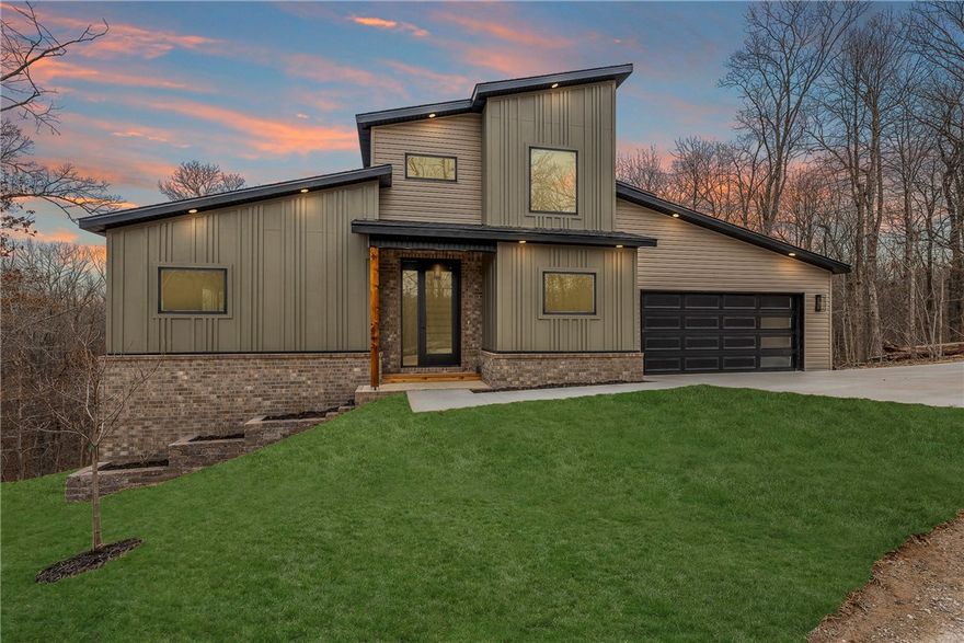 Welcome to 20 Yarrow Lane — a contemporary home thoughtfully designed for comfort, light, and modern living. Ideally located near Loch Lomond on a quiet cul-de-sac, this property offers both convenience and privacy, backing to POA land for a beautiful wooded backdrop. The well-planned layout features a private primary suite on the main level, with two additional bedrooms and a versatile flex space upstairs. The open-concept living area feels bright and expansive, with soaring ceilings and abundant natural light that create an inviting atmosphere, while clean lines and modern finishes maintain warmth and livability. Pre-wired for sound and security, this home is ready for today’s connected lifestyle, and a one-year builder warranty is included for added peace of mind.