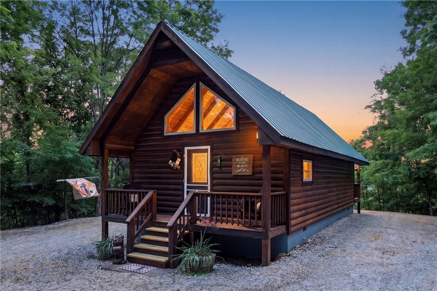 Wait no more for that get away log cabin on 7.77 wooded acres with that tranquil view of the Ozark Mountains. There is a guest room in the bunk house and a small workshop storage in front of bunk house.
Cabin comes completely furnished with the exception of your personal touches.  Fireplace is propane for those cozy cooler nights.  Nice glass walk in shower  if you don't want to relax in the jacuzzi tub.  Covered deck to sit and enjoy those breathtaking sunsets or early morning coffee.  Property like this doesn't appear on the market very often, so if this is your dream, call now. Can be used as a nightly rental. The MLS shows a price increase when that was a typo on my part, there has been no increase.