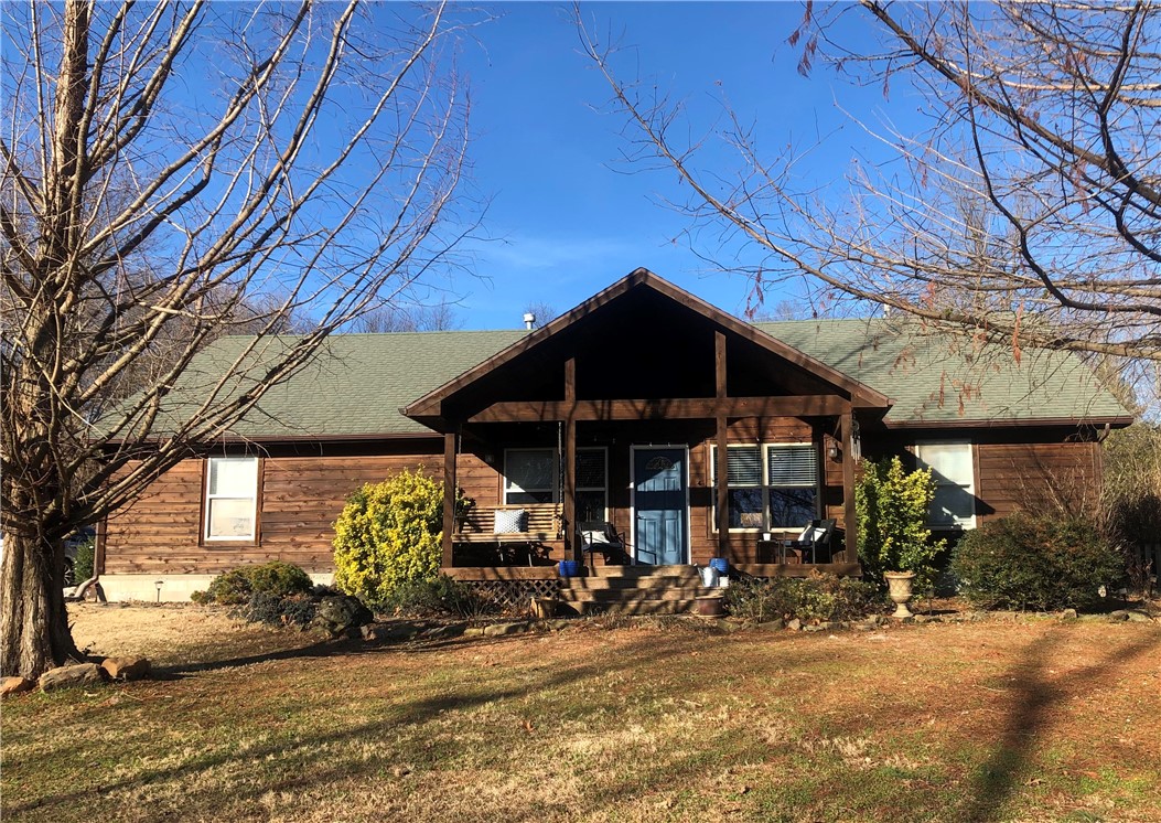 Custom home with open floor plan on .96 acres with an outstanding view of Lake Fayetteville, walk out the front door and you are steps to the Razorback Greenway Trail, a rare opportunity to have the Greenway and Lake Fayetteville right outside your front door! The best of Northwest Arkansas and the ideal location for bikers and hikers and anyone that loves the outdoors. Central location, close to everything and easy access to I49. Beautifully landscaped yard including koi pond and hot tub, also oversized garage allows for workshop space, updated kitchen, and bathrooms,new updated bamboo flooring. New roof installed 01/2021. Large abundant yard allows for lots or privacy, or property can be divided, sits on 3 legal parcels.