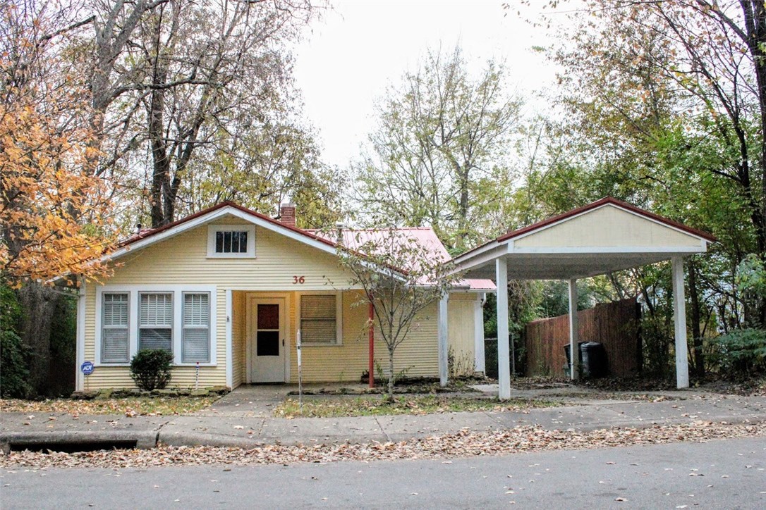 Charming, historic 2 bedroom 1 bath home only a short walk from the Fayetteville downtown
square, farmer's market, restaurants, grocery store, library, and park! New Floors, carport and roof were completed in 2010. Historic Clawfoot tub and sink in the bathroom. There are mature trees and a large deck in the fenced backyard perfect for long summer days and cozy winter nights! Refrigerator, stack clothes washer/dryer and large hot tub convey. Lots of new construction & renovations in this neighborhood.