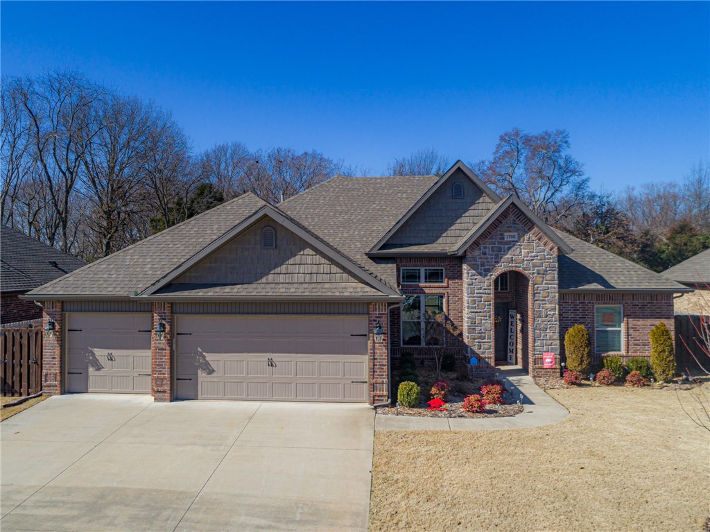 Like new home features open floor plan plus 3 car garage. Tall ceilings, spacious kitchen with granite countertops & custom cabinets. This smart home offers smart locking & Wi-Fi thermostat. Gas log fireplace in living room. Central vac. Covered patio has gas log fireplace and is wired for surround sound. Fenced yard for the furry friends. This location is ideal as it is minutes to the Walmart home office and Bentonville Downtown. Quick and easy access to I-49. You'll enjoy the community pool and club house in this sought after subdivision.
