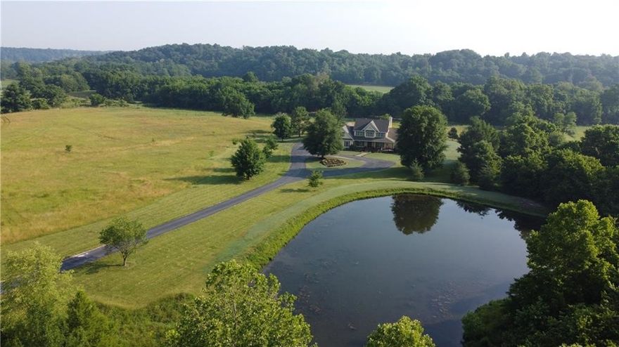Country Elegance! Refreshing Springs, beautiful creek frontage, perfect picnic, fishing, farming, appointed trees, spring-fed pond, and privacy. Lush countryside pastoral views. Breathtaking sunrises/sunsets normal here. Flyover Canadian geese visit often. Crystal-clear Brush Creek perfect for rejuvenation of soul and family enjoyment. Horses, livestock, fish, gardening & more. Caretaker's vision utilizes natural contours of land in conjunction producing protected aesthetically pleasing panorama. 579 unfinished sq. ft. above garage. Texas Hill Country 1880's oak mantle in great room, white oak flooring in west wing downstairs, elegant updates. Designer patio extends living space in quintessential setting. Adjoining additional acreage of either 7.61 or 17.75 acres available. Refer to MLS# 1269106 and MLS 1269112. Watch the attached video.
