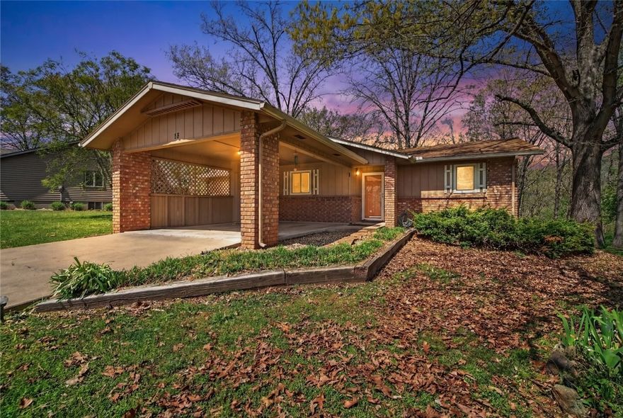 Looking for a stylish,  affordable and well-kept home in Bella Vista on a mostly flat lot? Tucked into a neighborhood among mostly larger homes, this tidy and well-kept home is truly move-in ready. The open concept living area  is filled with natural light from numerous windows, creating a comfortable and serene atmosphere. Newly painted kitchen cabinets add a fresh, updated touch, and the layout flows easily into the main living space, ideal for everyday living and casual entertaining. A standout feature is the heated and cooled sunroom, perfect as a home office or quiet retreat overlooking the treed backyard. Additional features include a carport with an attached storage room. The septic tank was replaced in 2021, offering peace of mind. Positioned near the Lago Vista Spur Trail and Highlands Golf area, and under 15 minutes to the Oz Trail Bike Park, this home offers effortless access to Bella Vista’s top trails, golf, and year-round outdoor adventure.