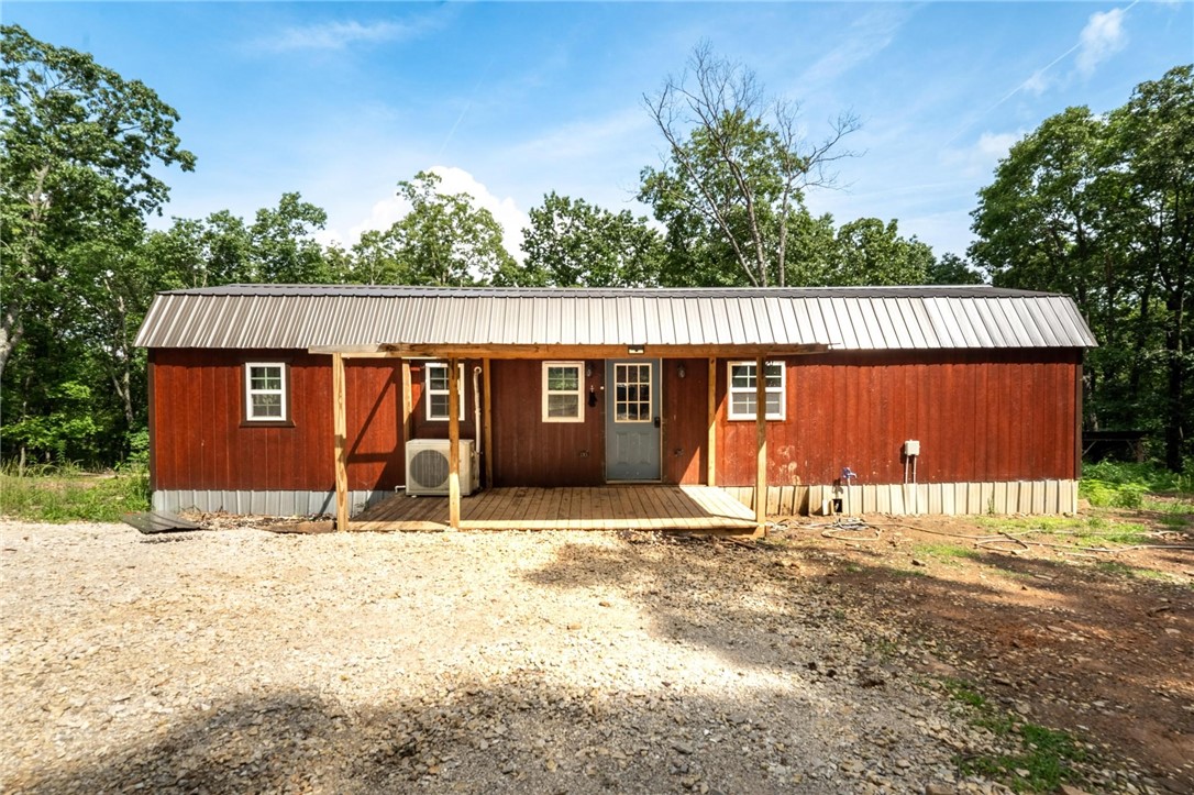 Great opportunity to own land with utilities already in place and a cabin to live in while you build your dream home on over 18 acres or it would make a great hunting cabin close to town. The cabin features insulation with Rockwool and Derksen, 50 gallon water heater, 2400 BTU mini split, whole house surge protection and a Fisher Mama Bear wood stove. Barn is 36 x 40 and well insulated with 1 1/2 inch rigid foam. Property features 300 yard shooting range with targets, hunting house by the pond, ladder stand, smokehouse, wood shed, beautiful pond, multiple wet weather creeks as well. There are two electric meters on the property and internet access as well.
There are multiple well maintained trails around the property for easy access to all areas. All this is less than 20 minutes to downtown Fayetteville. Also listed at same address MLS #'s 1310924 & 1310923