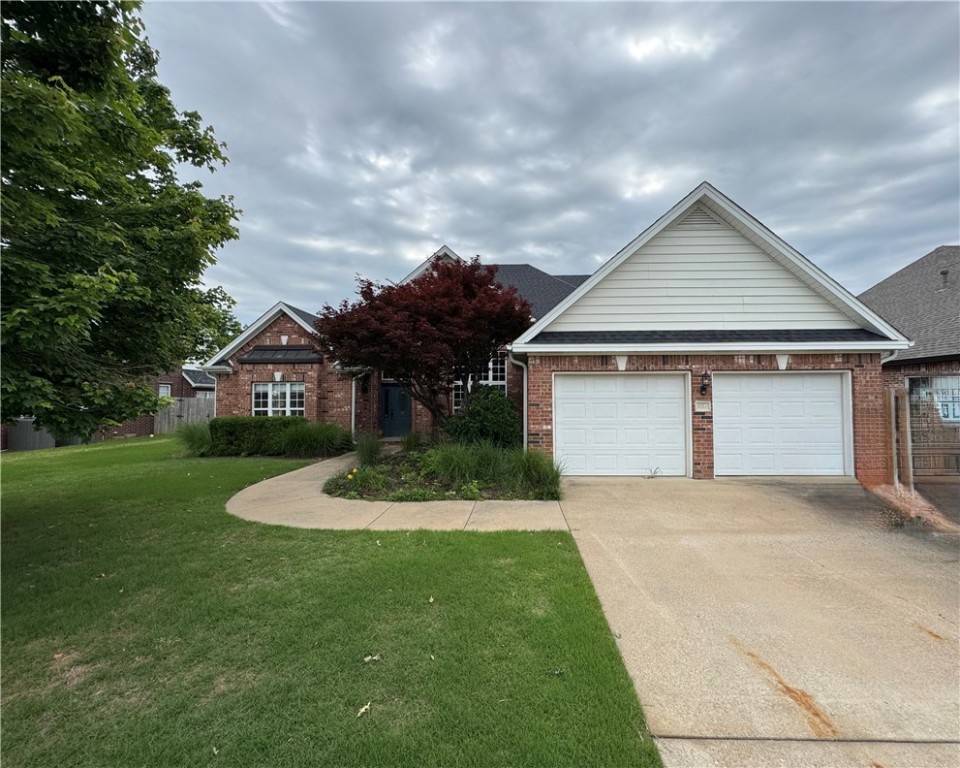 Stunning home with 14' entry ceilings, rich woodwork, and a seamless floor plan in a prime Bentonville location—just minutes from I-49, NWACC, Downtown, Walmart HQ, parks, and trails. Features 4 spacious bedrooms, 3.5 baths, a formal dining room, office, and an inviting great room perfect for entertaining. The gourmet kitchen boasts stainless steel appliances, granite countertops, and custom cabinetry. Relax in the luxurious primary suite with dual walk-in closets, a jacuzzi tub, and a large tiled shower. A perfect blend of elegance, comfort, and convenience!