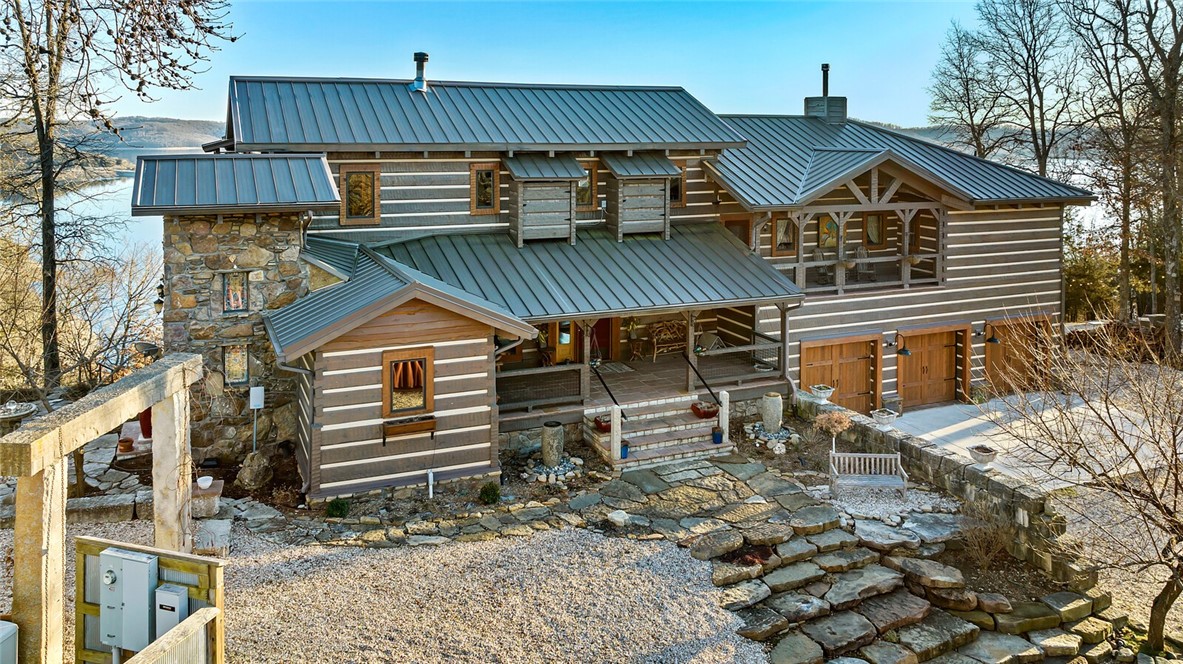 Discover an exceptional investment opportunity with this stunning 9.94-acre lakeview estate, currently operating as a successful wedding venue and Airbnb. Featuring three beautifully designed homes totaling 7,800 sq. ft., this property offers breathtaking views, a community boat dock, and direct access to Sugar Ridge Resorts. Most bedrooms boast private decks, perfect for enjoying the serene surroundings. The meticulously maintained grounds including atrium, lush garden areas, and multiple fruit trees, creating a peaceful and picturesque retreat. Whether you're looking to expand your hospitality portfolio, develop a private luxury getaway, or host unforgettable events, this versatile property is a rare find. Donāt miss this chance to own a premier piece of lakeview paradise! Property also listed as Multi-Family MLS#1297920 and Residential MLS#1297830.