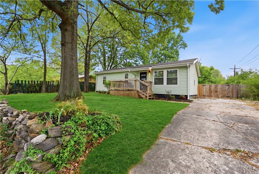 Welcome To Your Next Home! Fully Updated From Top To Bottom, Inside and Out And Just Down The Road From The University Of Arkansas, Razorback Stadium, Bud Walton, And Everything Fayetteville has to offer! Even Walkable To Watch The Hogs If Desired...When I Say This Home Is Fully Updated, I Mean It! Major upgrades approx 4 years ago. Newer Roof, New Windows, Water Heater, HVAC System, Paint, Trim, Doors, Hardware, Lighting, Cabinets, Counters, Fixtures, Electrical, Plumbing, Deck, Landscaping And More! Beautiful Original Hardwood Floors Run Throughout The Living Area, Halls And All Bedrooms, these were Just Professionally Refinished. Primary Suite w/ Full Attached Bath Offer A Custom Tiled Shower. 2 Secondary Beds + Full Hall Bath with Tub/Shower and Tile Surround. Front Deck + Large Covered Back Patio. Large Yard Full Of Mature Trees. Come See!