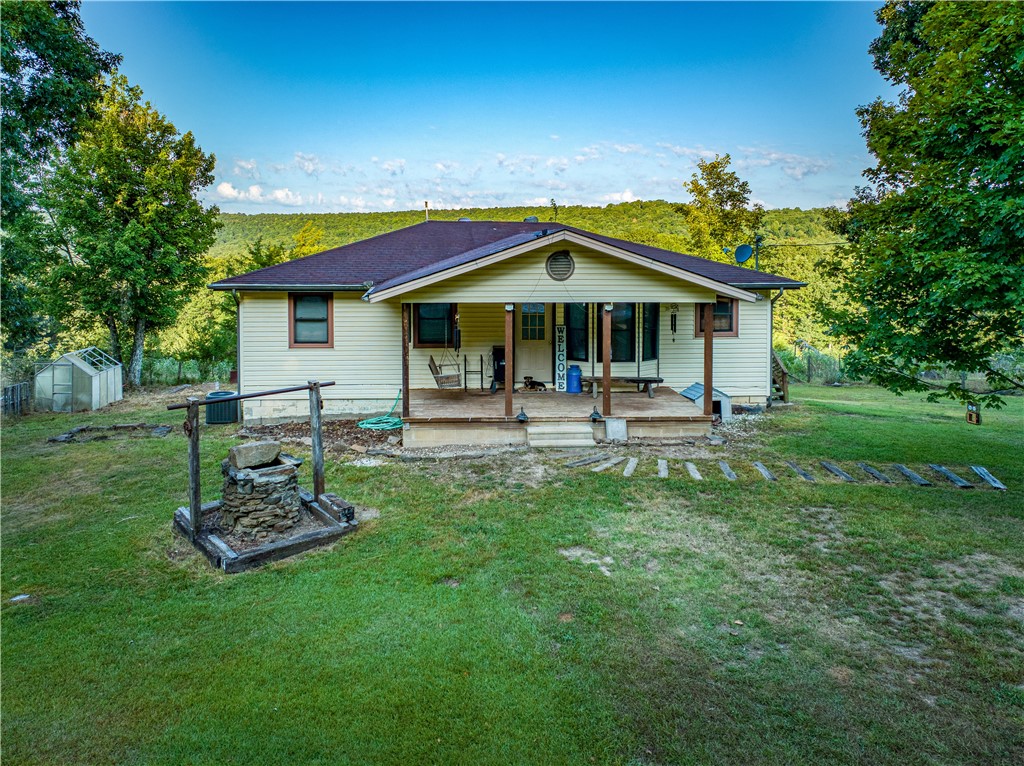 Located in the Pelsor/Lurton area, this 3 bed 2 bath home sits on 7 acres that directly borders National Forest land. The property is fully fenced and cross-fenced, featuring a pond, a 360 sqft portable building with electricāperfect for storage, hobbies, or a workshop, and an old well on property. The main level is 1,120 sqft of living space with new flooring, a semi-finished basement with 710 sqft finished space and 410 sqft unfinishedāideal for additional living, storage, or future expansion. Additional features include central heat and air, a carport, and no restrictionsāgiving you the freedom to use the property as you wish. A new roof and survey will be completed prior to closing, ensuring peace of mind for the next owner. The home is also conveniently located less than half a mile from the local fire department and Highway 123 S. Enjoy the best of the Ozarks right at your doorstepāRichland Creek, Pedestal Rocks Trail, the Ozark Highland Trail, and the Buffalo National River are all just minutes away.