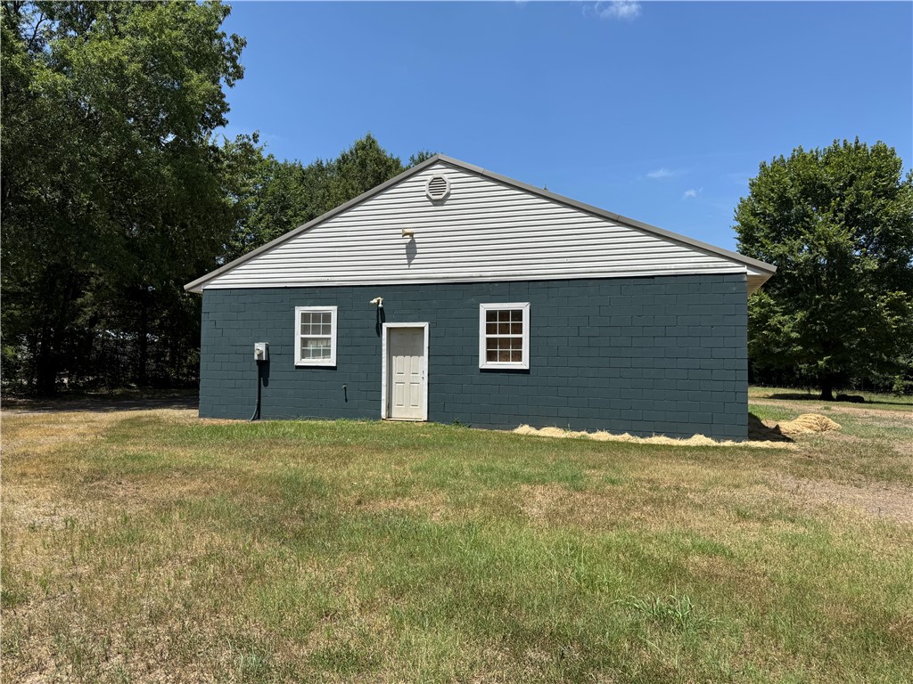 19.93 acres large pond with 60 x 40 insulated shop. There is electric, water and a small septic on the property and has hook-up for a camper. The shop has a full bath and 8 x 10 roll up doors (1 is automatic)