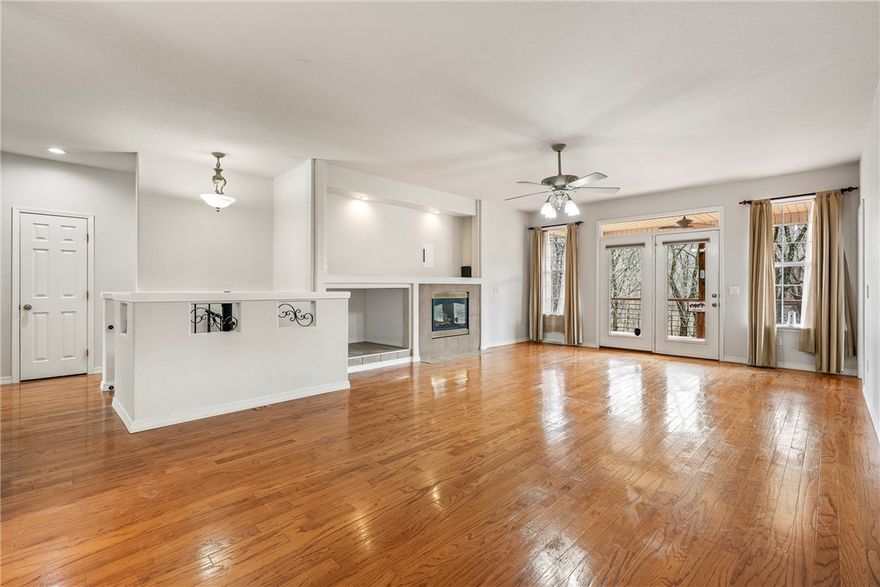 Located in one of Bella Vista’s most sought after outdoor corridors, this home offers direct access to the Snowbird section of the Back 40 Trail system just behind the property. Enjoy quick access to the golf course, Razorback Greenway, and nearby community amenities including a pool, playground, pickleball courts, golf, and a clubhouse, creating a true hub for active living.
The flexible floor plan features three bedrooms on the main level, an eat in kitchen, and a formal dining space that can easily serve as a home office. The walk out basement expands the living space with a large bonus room ideal for a gym, workshop, playroom, or media room, along with a fourth bedroom and ensuite bath.
Covered decks overlook a large, flat backyard surrounded by mature trees, offering wooded privacy, great curb appeal, and a peaceful bike friendly setting with direct trail access just steps away.  Very motivated seller!