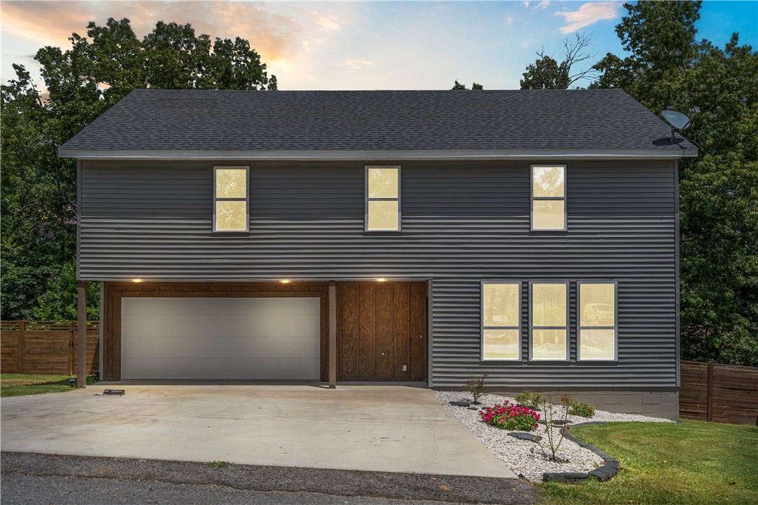 Welcome to 17 Rettendon Lane, where style, privacy, and location come together. Built in 2023, this stunning 3-bedroom, 2.5-bath home sits in a quiet cul-de-sac and backs to mature trees for ultimate seclusion. Entertain in style on the oversized deck complete with a wet bar, or unwind in the large fenced backyard. Inside, enjoy a thoughtfully designed two-level layout with modern finishes, abundant natural light, and a 2-car garage. Located just 2.5 miles from Lake Brittany, 1.5 miles from Snow Bird Trail Head and 1 mile from Dogwood Golf Course, itās the perfect blend of luxury living and outdoor adventure. This home is truly a rare find in Bella Vista!