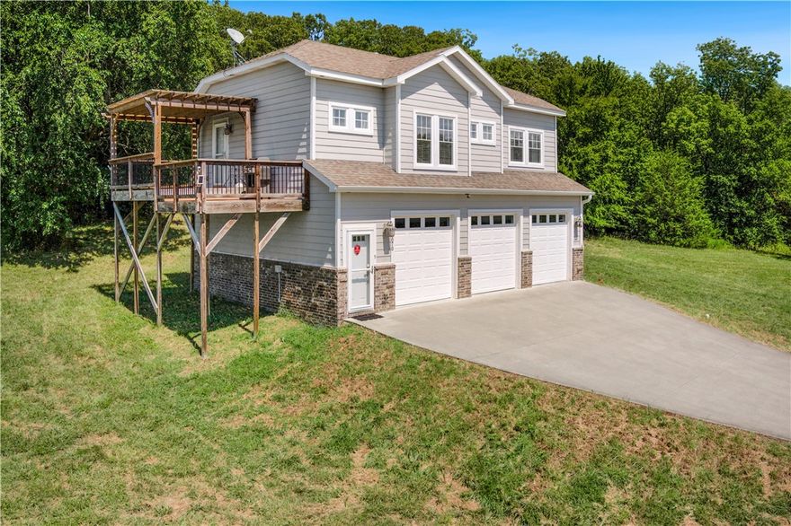 This well-constructed and meticulously cared-for home sits on prime East Fayetteville real estate.  Think big, because this spot has room for dreams and growth. Tucked into a mountaintop, this  17.5-acre property provides a unique blend of privacy and convenience to Fayetteville and Northwest Arkansas. The gently rolling acreage has open and wooded areas with spring-fed ponds and a fabulous year around view towards the Boston Mountains. 
The modern home, with its abundance of natural light and hardwood floors, features a spacious 3-car garage and a delightful deck that extends the living space outdoors. This location holds great potential, whether you're looking to nest, invest, or explore development opportunities.  Come see what could be yours. It's not just real estate; it's a real opportunity!