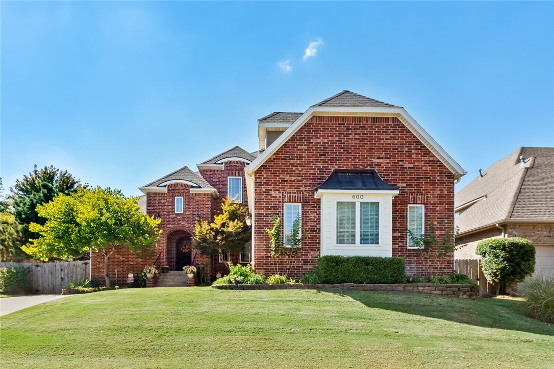Immaculate 4-bedroom home, PLUS office, PLUS game room, PLUS formal dining! Located in a very desirable neighborhood, this home is close to the Greenway trails, new Walmart home office campus & minutes from Downtown Bentonville! The dream kitchen has two islands, large pantry, 4'-professional gas range with double oven & is open to the large vaulted great room with floor to ceiling brick fireplace! Beautiful breakfast nook is surrounded by windows! Main floor master suite with large walk-in closet, double sinks, walk in shower & jetted tub. The main level also features a second bedroom & office! Large mud room has plenty of extra storage, utility sink & even a laundry chute! Upstairs features 2 more bedrooms with a Jack&Jill bathroom & large game room! Lots of extra storage throughout with walk-in attic! New water heater, new roof to be installed. Beautiful backyard has a covered patio, mature trees & is fully fenced. Newer carpet & paint. Easy access to I-49, trail system, downtown, schools & shopping!