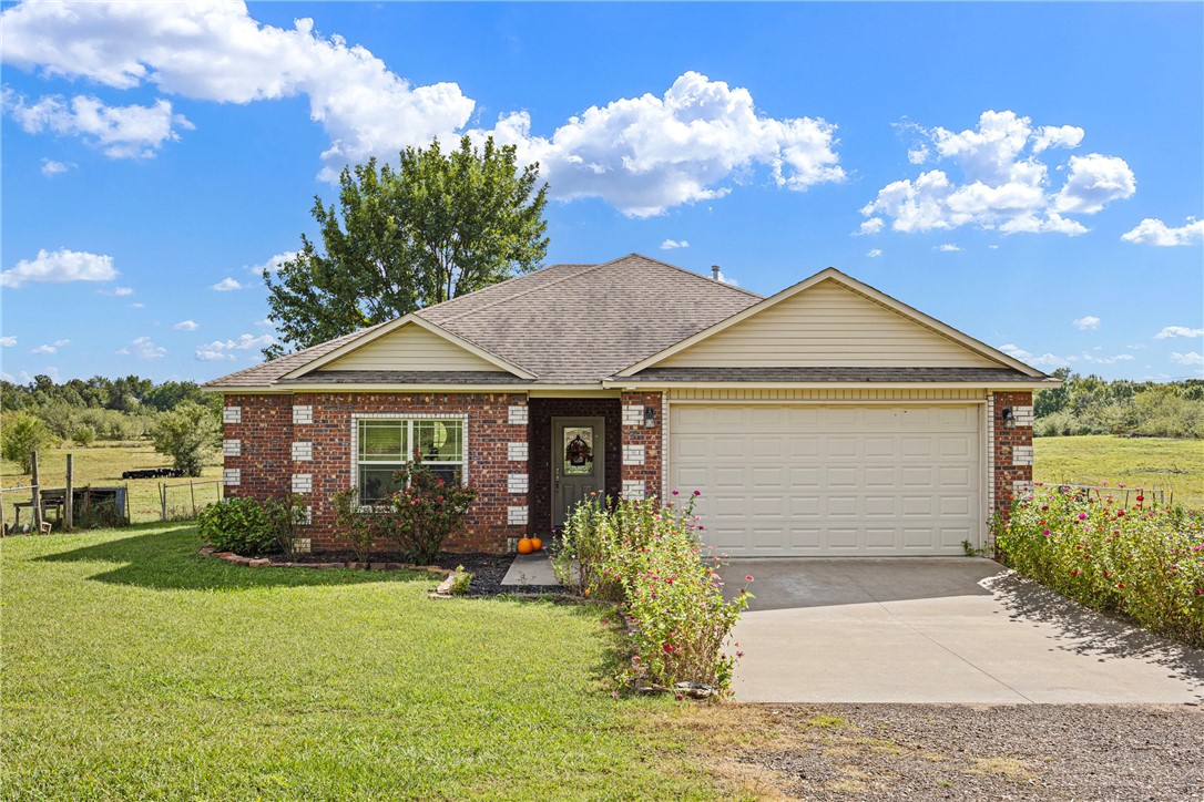 Step into this charming all-brick home featuring 3 bedrooms, 2 full baths, and an open kitchen/dining area that overlooks 40+ fully fenced acres. Perfect for your own livestock or continue with the current land tenants for added income. Fenced in back yard for the kiddos and pets.
Enjoy lower utility bills with solar panels, while the beautiful flower gardens create a warm welcome as you arrive to the driveway. A large pond stocked with fish sets the scene for family fishing days and peaceful country living. With approximately 1700 sq. ft. of living space, this property combines comfort, functionality, and the beauty of wide-open land.