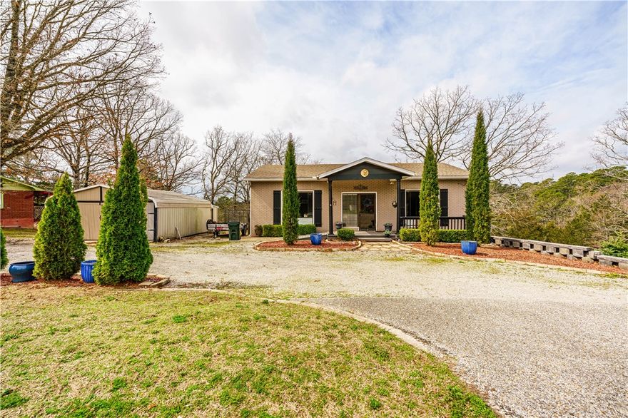 A rare 3,500+ sq. ft. live/work opportunity just outside Eureka Springs—where creativity, business, and home all come together. This versatile property is zoned for residential or commercial use. Previously home to an art gallery and glass-blowing studio, the layout easily supports retail, gallery, boutique, salon, office, Airbnb, or dual-level rental possibilities. The property includes a spacious gallery area at street level, multiple flexible living and work spaces, three bedrooms (another work space could be the 4th bedroom), an office, two large living areas, and an updated kitchen with granite countertops. A fireplace adds warmth and character, while central heat and air, double-pane windows, and architectural shingles provide comfort and efficiency. Covered porch, patio, and the deck areas offer inviting outdoor space, and a detached 2 car garage and separate storage building provides ample space needed. A unique opportunity to combine business, creativity, and comfortable living near Eureka Springs.