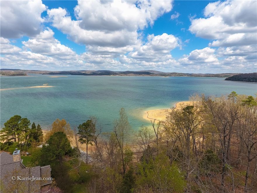 Lake Estate-Breath taking French Country home. This truly amazing flat lakefront & unbelievable lakeviews of Beaver Lake, 4+ acres, 2 slip boat dock. 8974 with 2 bdrm 1 bath guesthouse. Main 6 bedrooms, 5 baths, 3 living areas, numerous ceiling treatments, security system, Pella windows, red & white oak floors, Top of the line appliances, warming drawers, kitchen island with prep sink, Tongue-in-groove ceiling, Built-ins, Cedar closets, You'll never leave home!